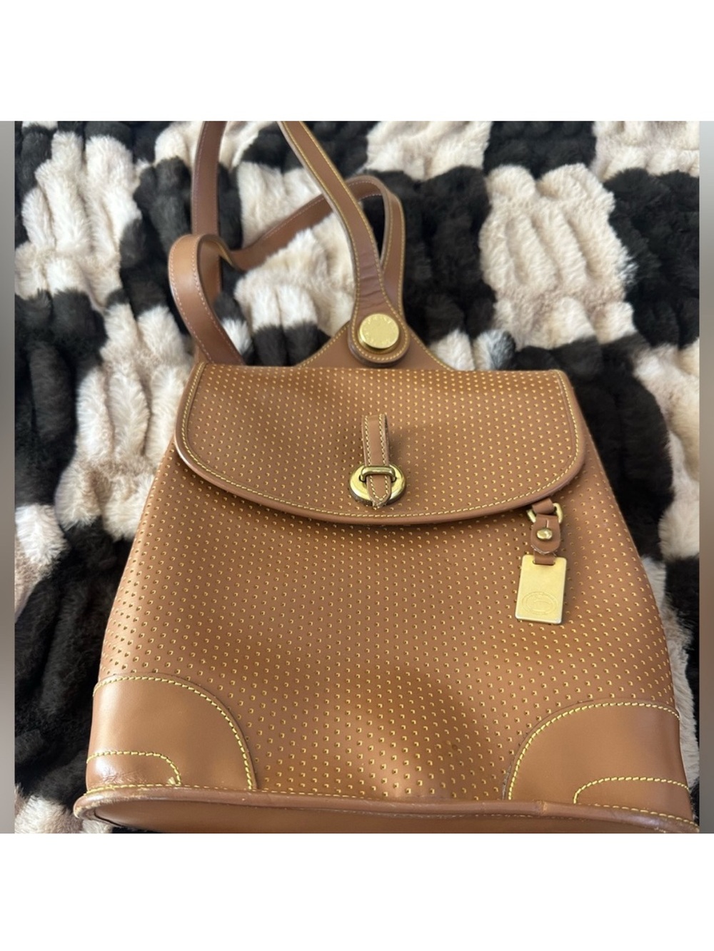 Vintage Dooney & Bourke Cabriolet Perforated Leather Backpack.